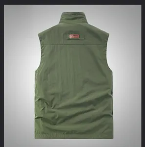 Detailed back view of army green outdoor utility vest with classic leather patch