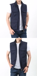 Detail view of multi-pocket dark blue outdoor vest with stand collar and metal zipper
