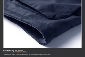 Detail of navy polar fleece vest hem showing precise stitching and warm lining
