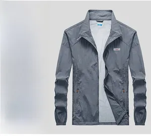 Detail view of dark gray sun protection jacket with outdoor professional logo and zipper