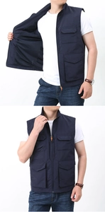 Detail view of men's navy blue multi-pocket vest with mesh lining and stand collar