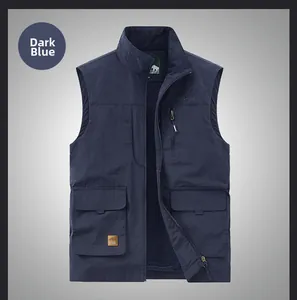 Detail view of dark blue outdoor vest featuring multiple utility pockets and zipper closure