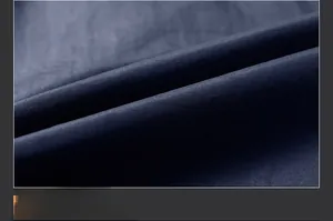 Macro detail of navy blue double-sided polar fleece fabric with soft brushed texture