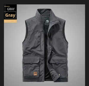 Detail view of deep gray outdoor cargo vest with multi-pockets and leather logo label