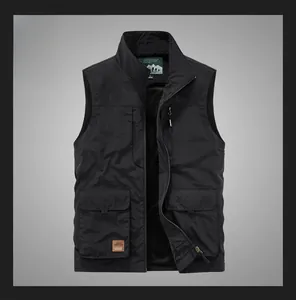 Detail of black outdoor utility vest showing multi-pocket design and stand collar