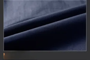 Macro shot of dark blue quick-dry polar fleece fabric with soft brushed texture