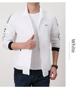 Detail of white hooded quick-dry jacket featuring contrast black cuffs and Free Spirit text