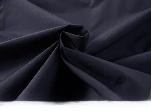 Close-up of lightweight textured fabric on a multi-pocket outdoor fishing vest