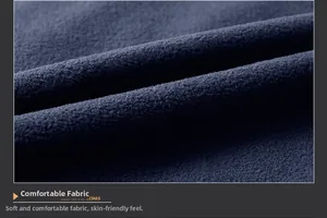 Macro texture of soft navy blue polar fleece fabric showing premium warm material