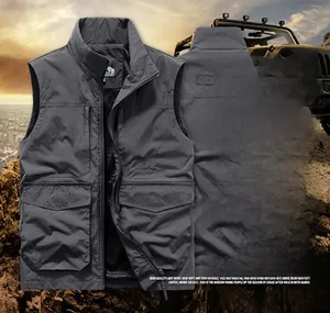 Detail view of dark grey outdoor fishing vest with multiple functional zipper pockets