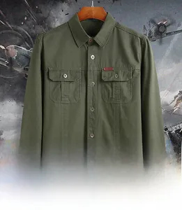 Close-up of army green tactical shirt featuring double chest pockets and outdoor label