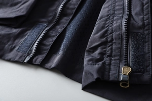 Detail of waterproof outdoor jacket with metal zipper and breathable mesh lining