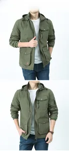 Detail of army green military jacket featuring multi-pockets and drawstring hem