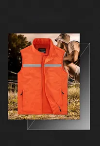 Detail of orange outdoor vest featuring reflective safety strips and breathable mesh lining