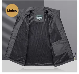 Detail view of breathable black mesh lining and inner pocket on grey fishing vest