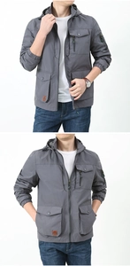 Detail view of grey hooded cargo jacket featuring utility multi-pockets and zip closure