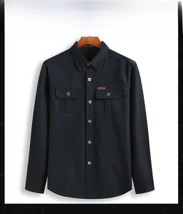 Detail of navy blue cargo shirt featuring double chest pockets and outdoor label