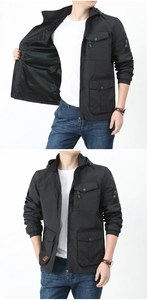 Detail of breathable black mesh lining and multi-pocket design on outdoor utility jacket