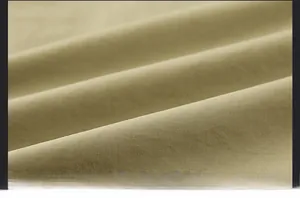 Macro detail of khaki outdoor vest showing wear-resistant and scratch-proof woven fabric