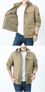 Detail of khaki outdoor jacket showing breathable mesh lining and utility zip pockets
