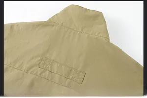 Detail view of khaki vest back neckline with uniform and smooth stitching craftsmanship