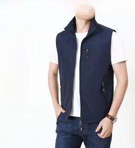 Detail view of the stand-up collar and secure zipper pockets on this navy outdoor vest