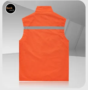 Detail view of the orange safety vest back featuring a wide horizontal reflective strip