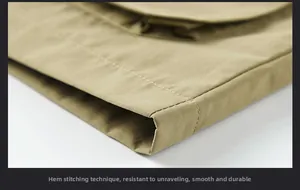Close-up of khaki outdoor vest hem featuring precision single-needle flat stitching detail