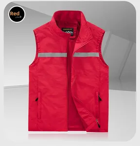 Detail of red vest showing high-visibility reflective tape and breathable mesh lining