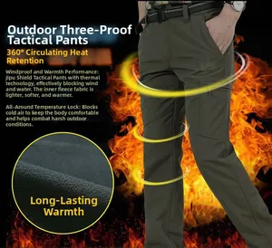 Detail view of winter tactical pants showing warm black fleece lining and flame effect