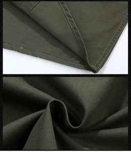 Detail of military green cotton twill fabric and reinforced double-stitched seams