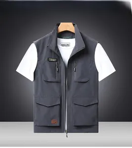 Detail of the multi-pocket gray outdoor vest with functional zippers and stand collar