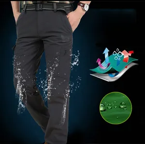 Water-repellent outdoor cargo pants with zipper pockets and lotus effect fabric detail