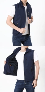 Detail view of navy multi-pocket outdoor vest featuring breathable black mesh lining