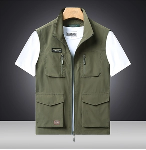 Detail of army green outdoor vest with functional multi-pockets and front zipper closure