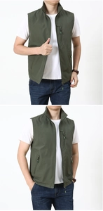 Detailed view of the olive green outdoor vest with multi-pocket design and standing collar