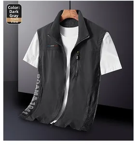 Close-up of dark grey outdoor vest with breathable mesh side panels and zipper pocket