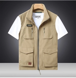 Detail view of khaki multi-pocket outdoor vest featuring stand collar and zipper pockets