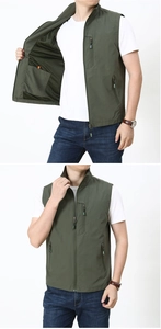 Detail of army green fishing vest featuring mesh lining and multiple functional zipper pockets