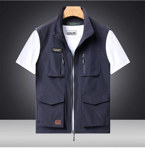 Close-up of a blue outdoor vest with multiple utility pockets and zip fastening