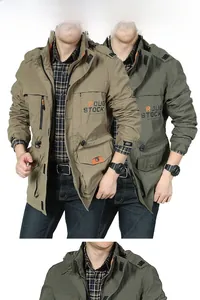 Detail of outdoor hooded jacket showing classic utility pockets and plaid inner lining
