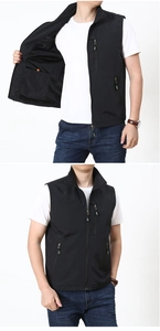 Detail view of the black outdoor vest showing breathable mesh lining and inner pocket