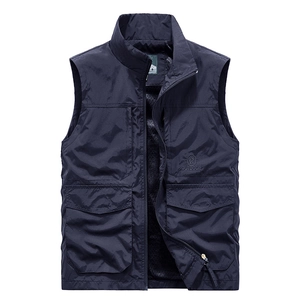 Men's dark blue outdoor vest with multi-pocket utility design and stand collar