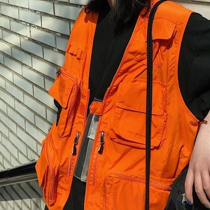 Bright orange quick-dry tactical vest with multiple utility pockets for outdoor activities