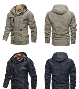 Detail view of multi-pocket windbreaker jacket with contrast orange lining and hood
