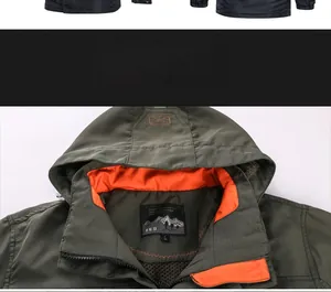 Detail of army green waterproof jacket with bright orange lining and high collar zipper