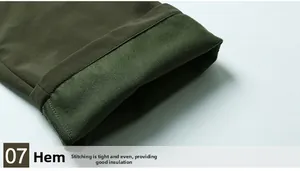 Detail of army green trousers showing thick fleece lining and durable windproof fabric