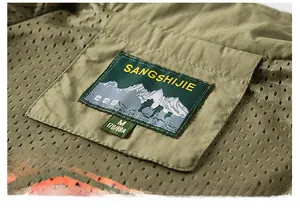 Macro view of olive green outdoor vest showing mesh lining and neck stitching detail