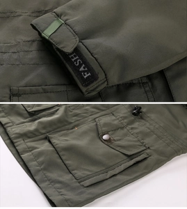 Detail of army green outdoor jacket featuring velcro cuffs and multi-functional cargo pockets