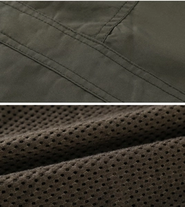 Detailed macro view of durable army green canvas fabric and breathable mesh lining
